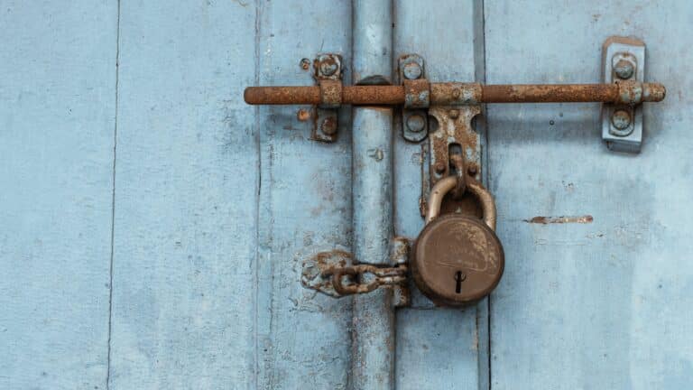 a blue steel door with a lock