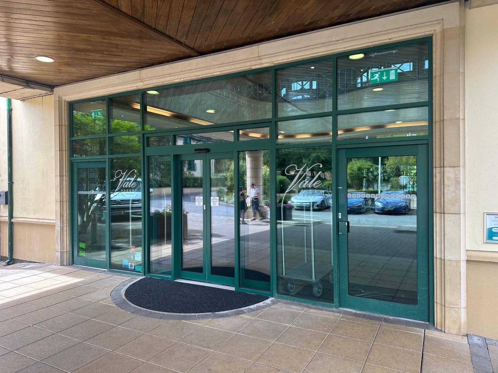 Outside image of an automatic sliding door at the entrance to a golf hotel. Automatic Door Replacement at a Golf Hotel by J Manny.
